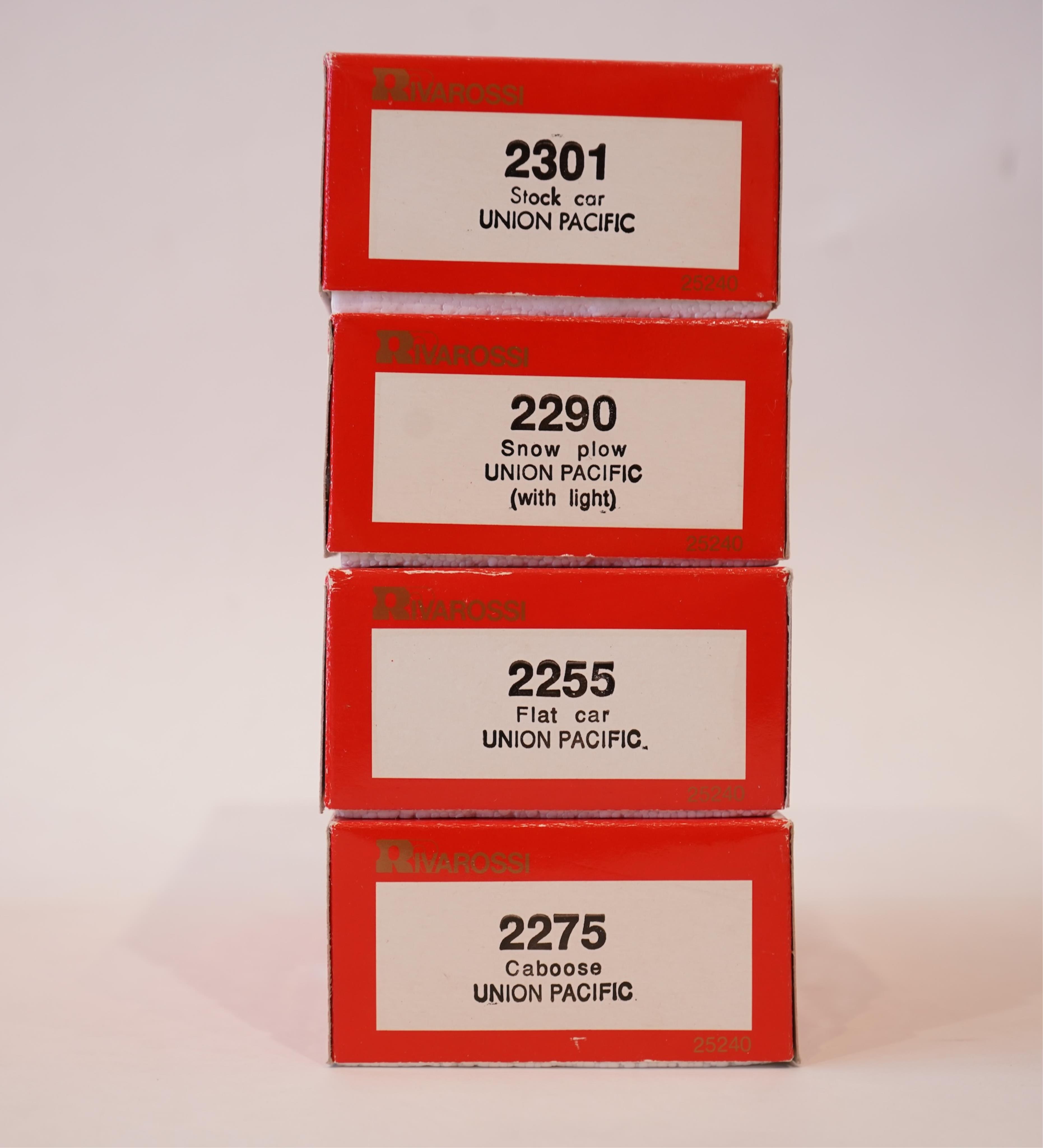 Two boxed Rivarossi 1930s Union Pacific coach packs; A Set (6964) and B Set (6965), both containing four coaches, together with three individually boxed coaches (2654, 2689 and 2814), plus four bogie freight wagons (2255